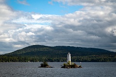Clouds and Blue Sky Over Loon Island Light in NH